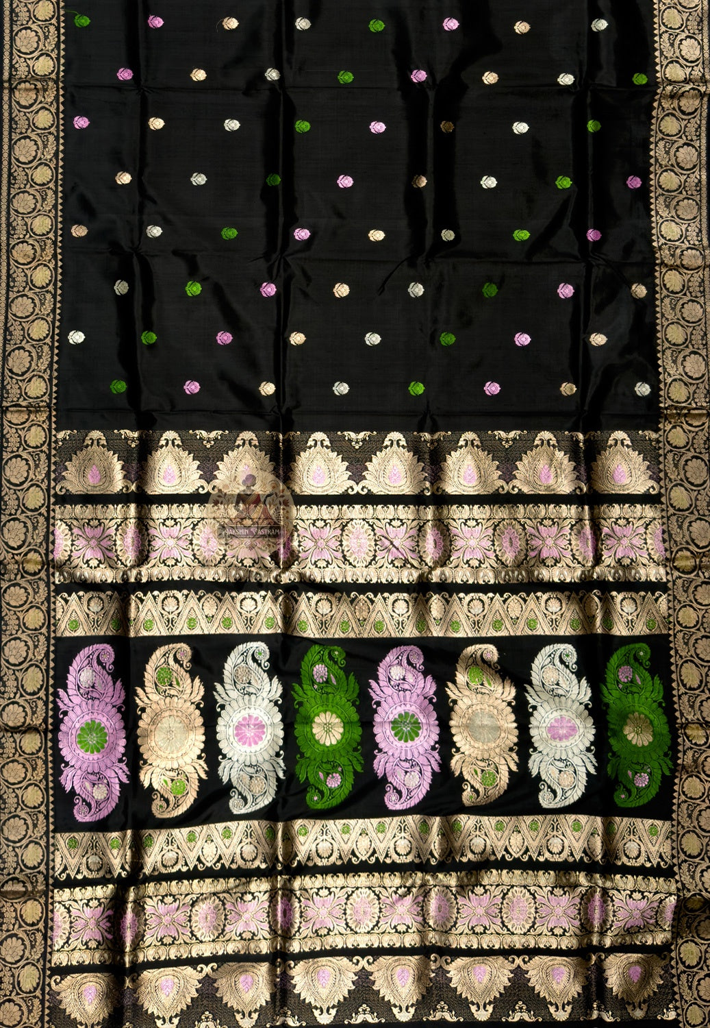 Close-up of premium Swarnachari silk saree pallu showing hand-woven golden zari panel with Bengal royal court figures and temple tradition compositions poised at the threshold between craft and occasion