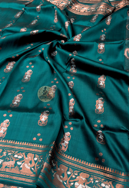 Rear view of Swarnachari silk saree displaying wide golden zari pallu with densely woven mythological and temple-art narrative panels