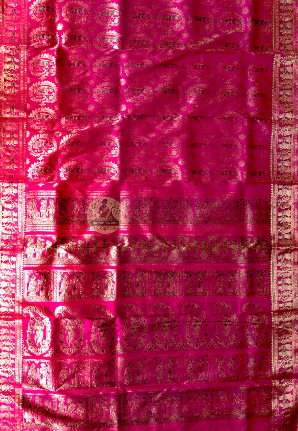 Rear view of pink Swarnachari silk saree showcasing fully expressed pallu with mythology and Bishnupur temple art golden zari compositions glowing warmly on festive pink pure silk ground