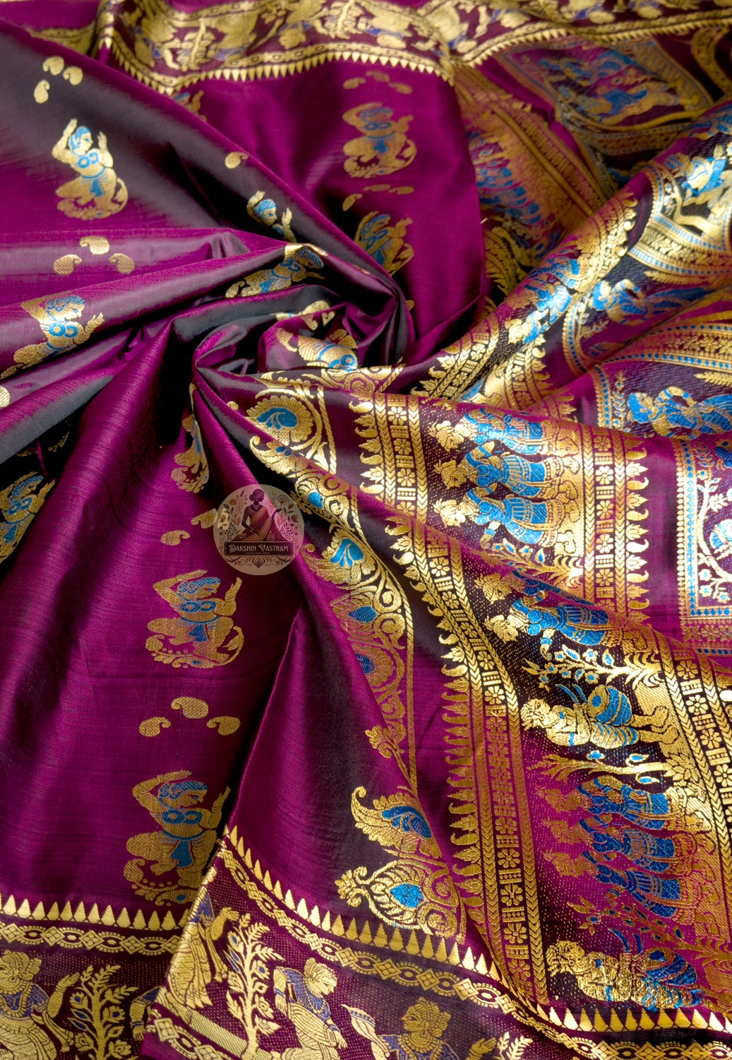 Rear view of coffee Baluchari silk saree showcasing fully expressed pallu with Ramayana Mahabharata and Shakuntala narrative compositions individually woven in silk thread on coffee ground