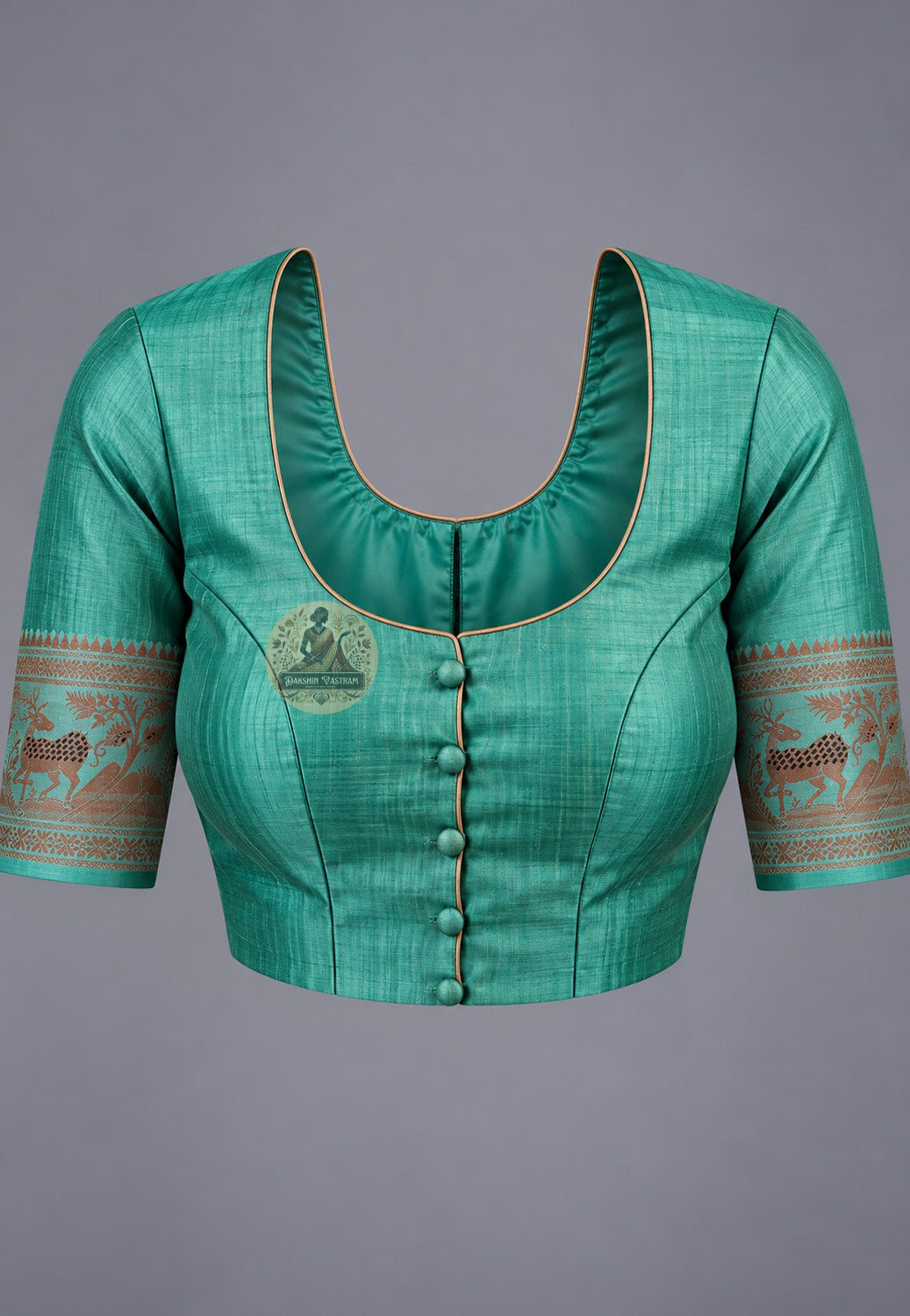 Blouse paired with green Swarnachari silk saree, featuring a contrasting patterned sleeve border