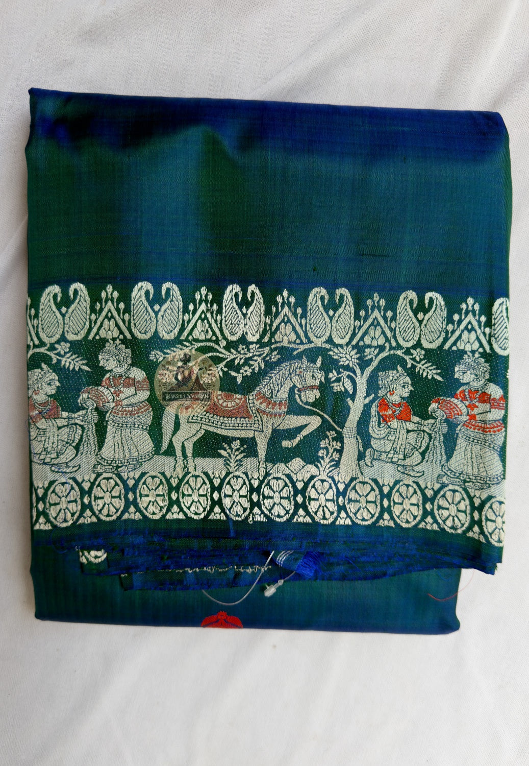 Close-up of hand-woven mythological motifs on Baluchari pure silk saree, traditional pit loom craftsmanship, Murshidabad West Bengal