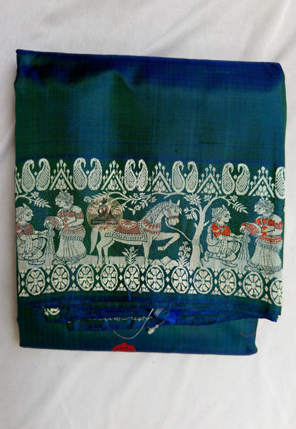 Close-up of hand-woven mythological motifs on Baluchari pure silk saree, traditional pit loom craftsmanship, Murshidabad West Bengal