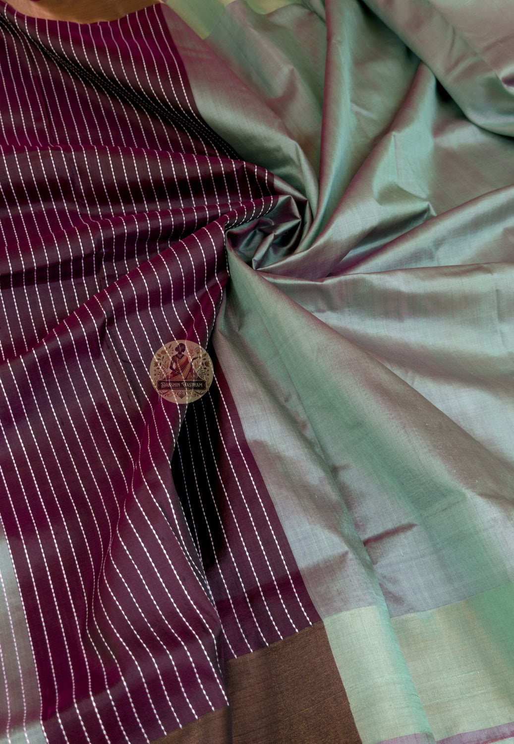 Detailed close-up of hand-woven border on Bishnupur Pure Katan Silk Saree showing the warm deep lustre of pure Katan silk and Bishnupur weave patterns that deepen and endure because they were made with time