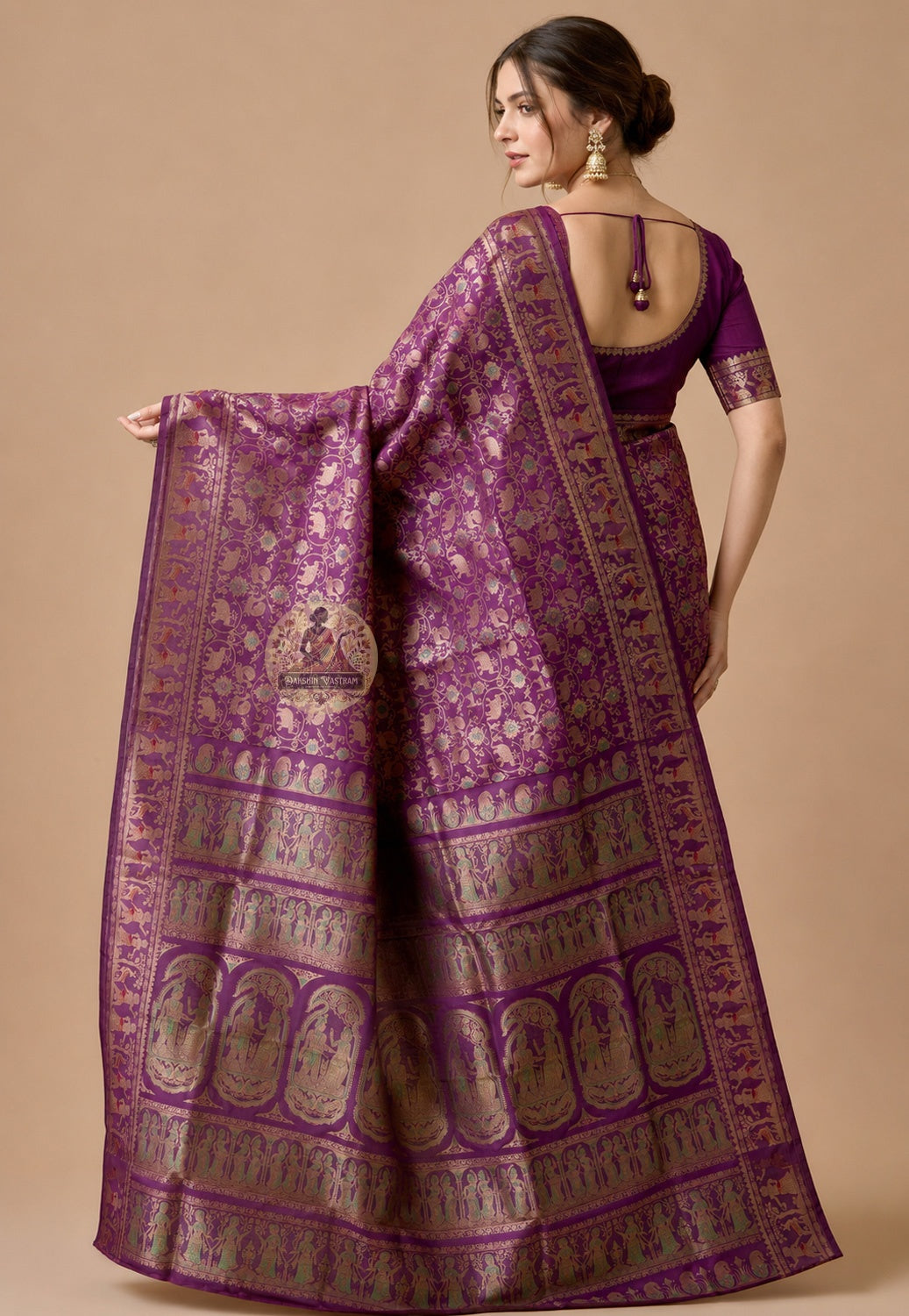 Front view of woman in premium Swarnachari pure silk saree, traditional Bengali drape with golden zari narrative pallu holding Bengal's mythological story over left shoulder