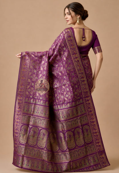 Front view of woman in premium Swarnachari pure silk saree, traditional Bengali drape with golden zari narrative pallu holding Bengal's mythological story over left shoulder