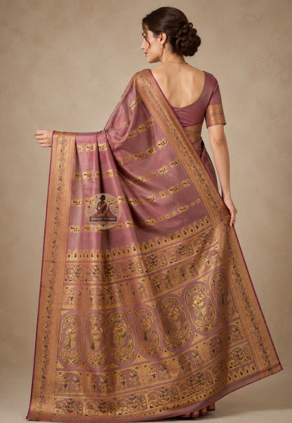 Front view of woman in handloom Baluchari silk saree, traditional Bengali drape with narrative pallu displaying Mahabharata story compositions woven in silk over left shoulder
