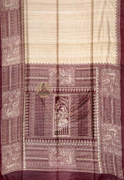 Close up of maroon saree border with pale ornamental panels and pointed motifs