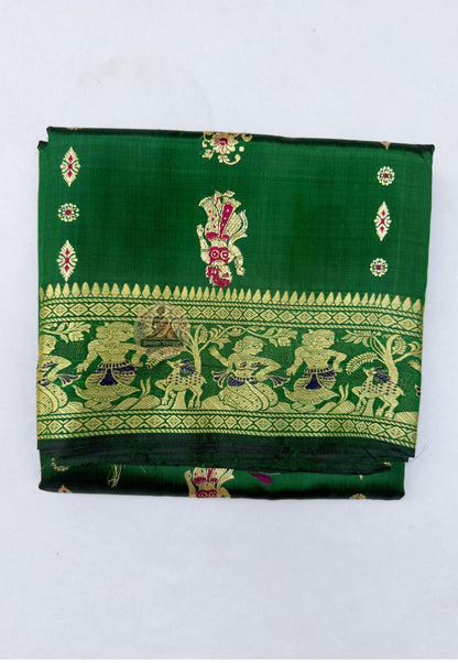Close up of pink and warm-toned woven motifs on the emerald green Baluchari silk saree body