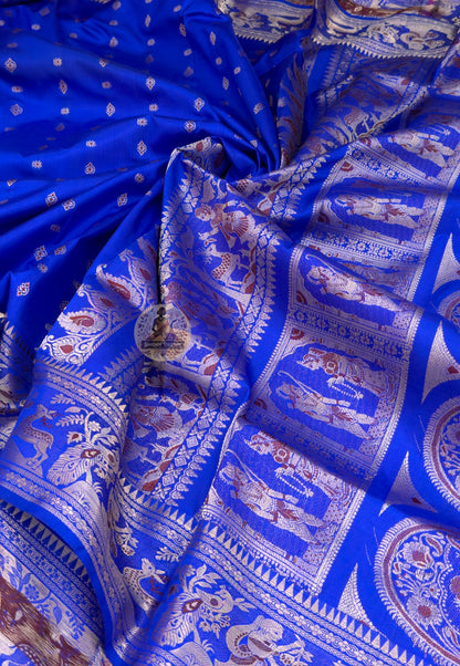 Close-up of Swarnachari silk saree weave texture showing fine handloom craftsmanship and lustrous Bengal silk