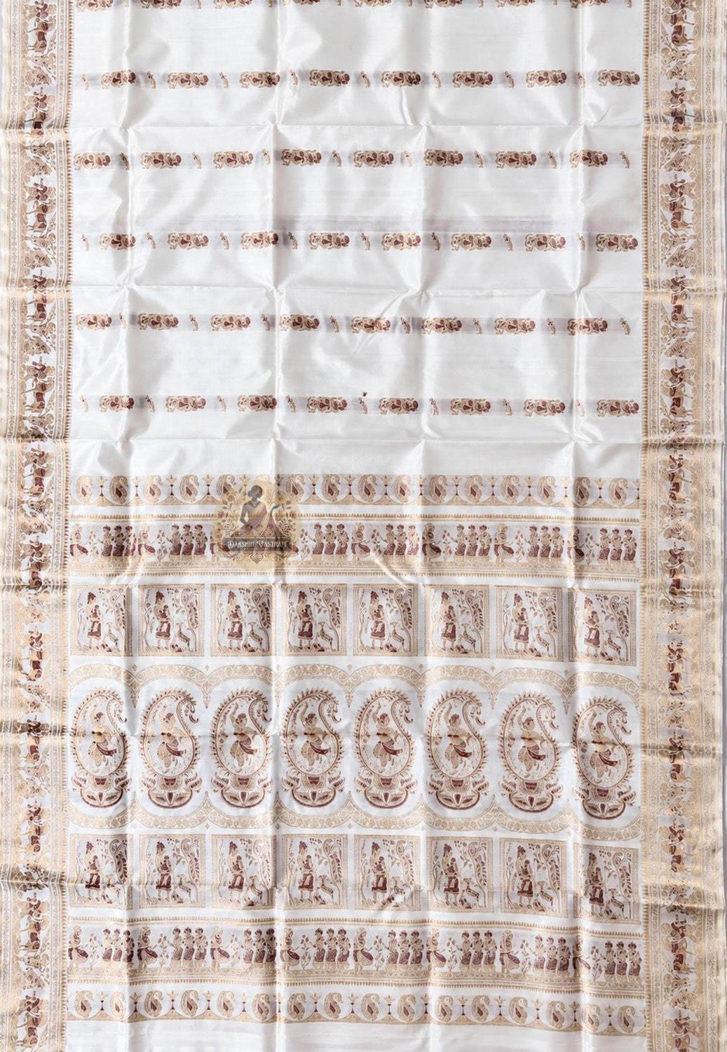 Close-up of pallu of white Swarnachari pure silk saree showing golden zari mythology and Bishnupur temple art compositions reading with precision and clarity on white silk ground