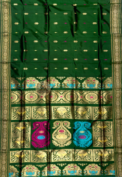 Side view of Swarnachari handloom silk saree showing golden zari witness border and warm pure silk drape of a tradition that has seen what endurance looks like, West Bengal weave