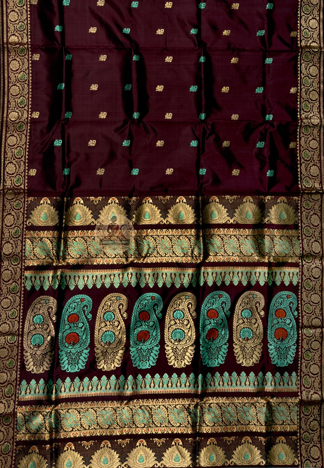 Full flat-lay of Swarnachari pure silk saree with golden zari dialogue border, tradition-in-exchange pallu, rhythmic buti field, and matching unstitched blouse piece, West Bengal handloom