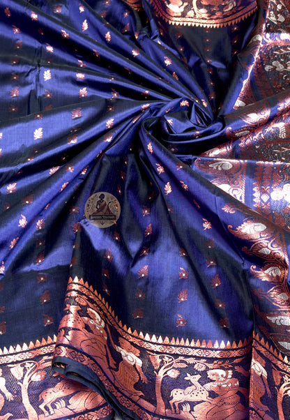 Full flat-lay of Swarnachari pure silk saree with golden zari tradition border, living narrative pallu, rhythmic buti field, and matching unstitched blouse piece, West Bengal handloom