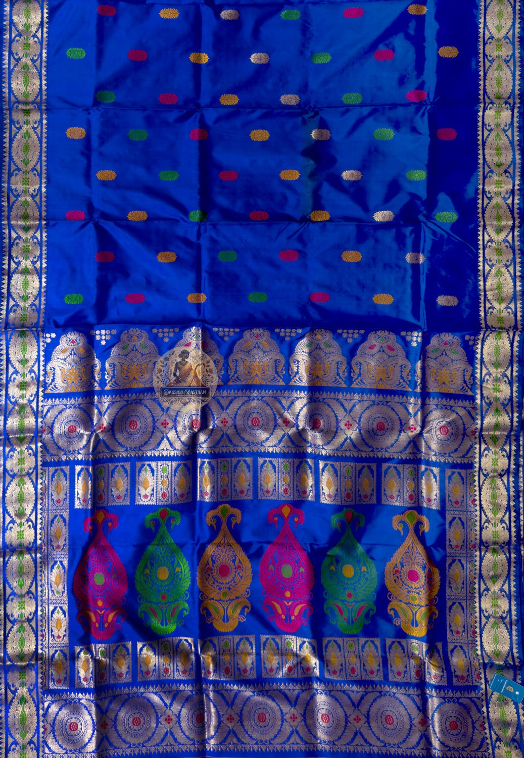Rear view of premium Swarnachari silk saree displaying golden zari pallu with clearly rendered hand-woven Bengal temple and royal court portrait compositions