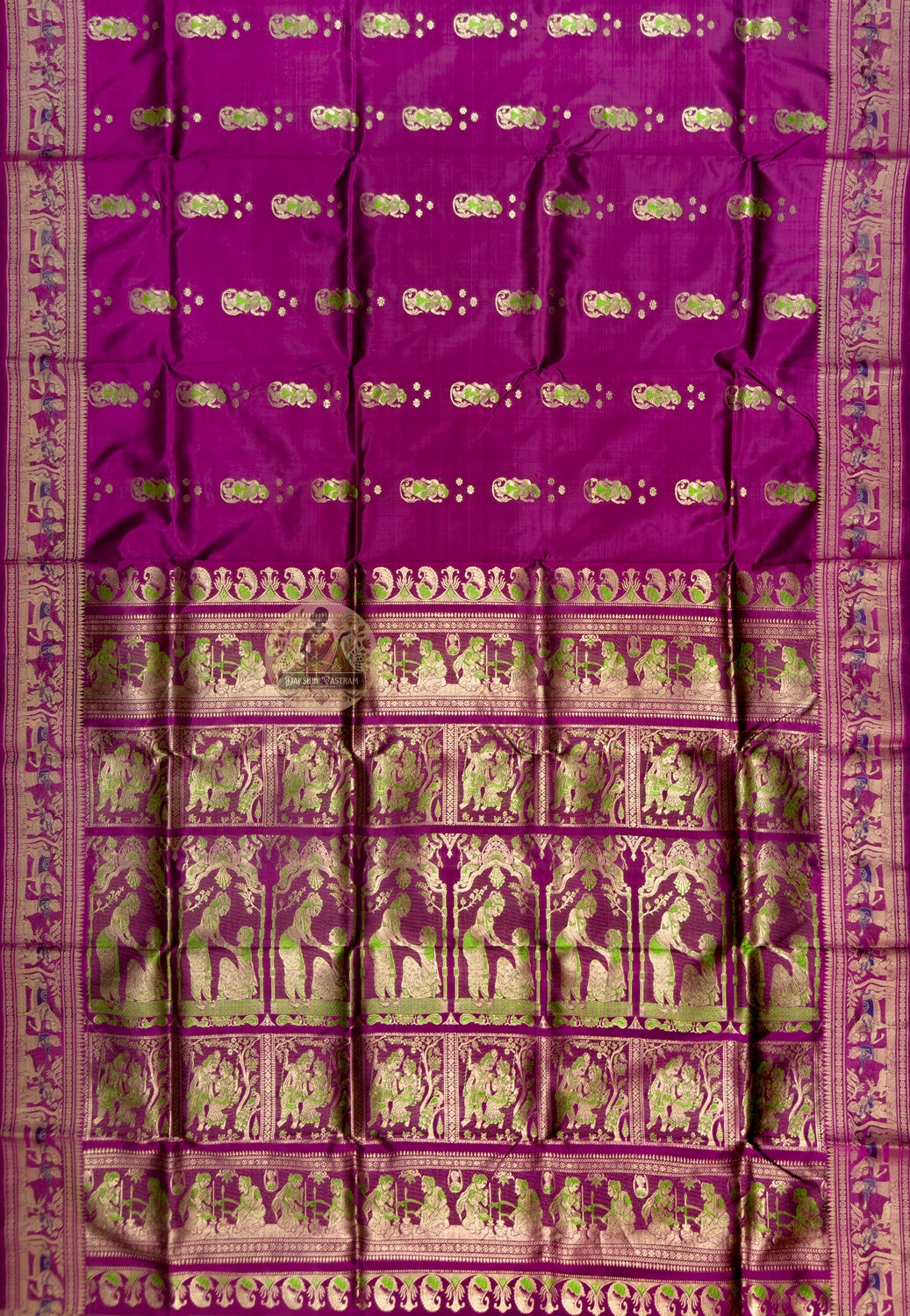 Full saree view of plum magenta Swarnachari silk saree with repeating motifs and an ornate pallu