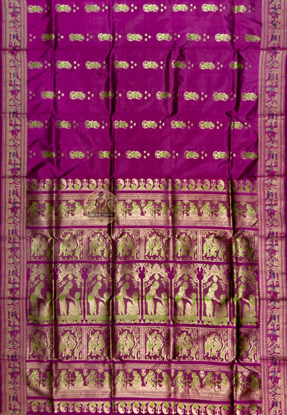 Full saree view of plum magenta Swarnachari silk saree with repeating motifs and an ornate pallu