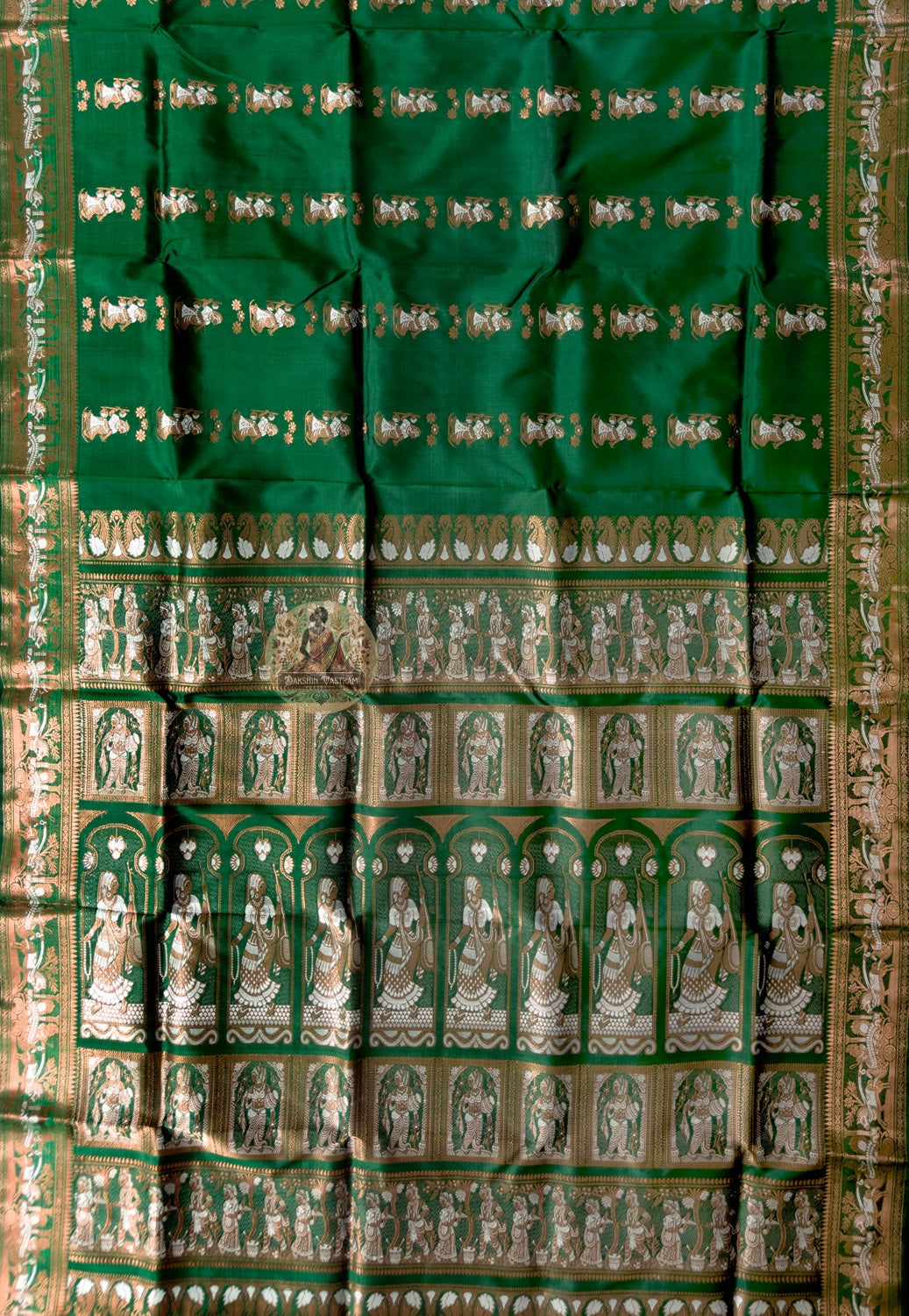Close-up of Swarnachari silk saree weave showing individually woven golden zari mythology figures Malla court motifs and Bishnupur terracotta temple patterns in handloom detail