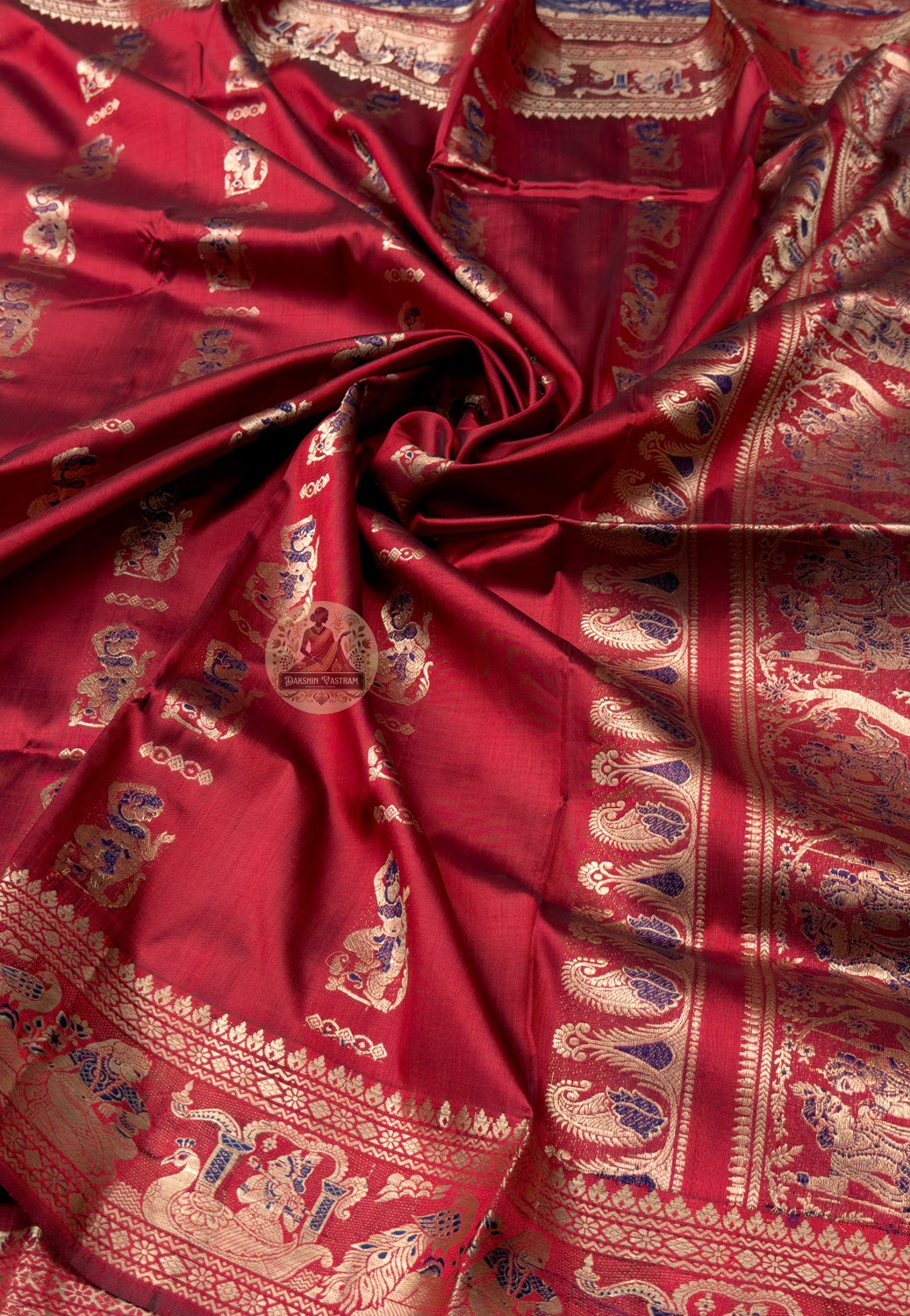 Rear view of Swarnachari silk saree showing full golden zari pallu with evenly spaced mythological court scene panels, West Bengal handloom