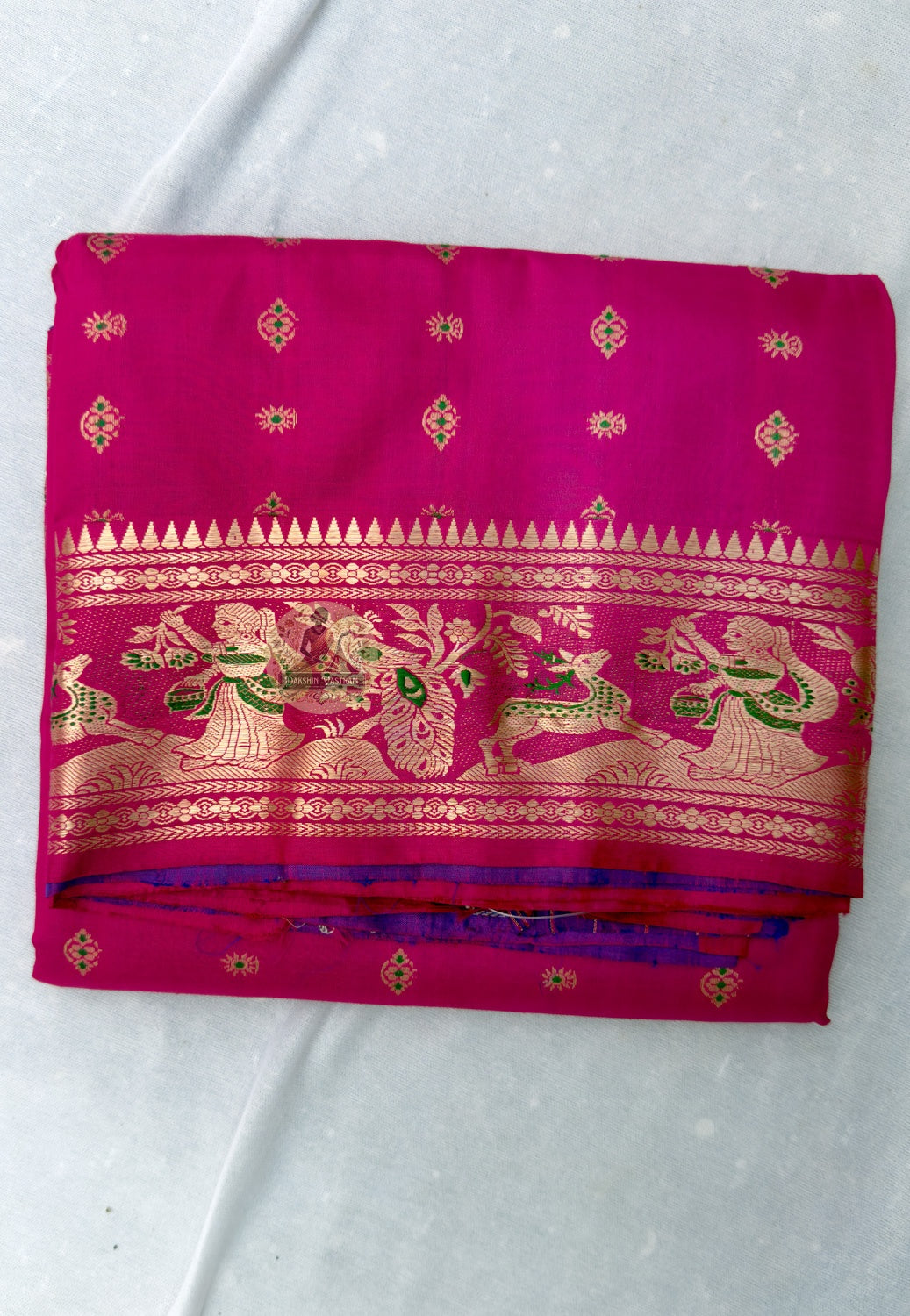 Full flat lay of Swarnachari Bengal silk saree with golden zari border and pallu, handloom heritage, six yards of gold