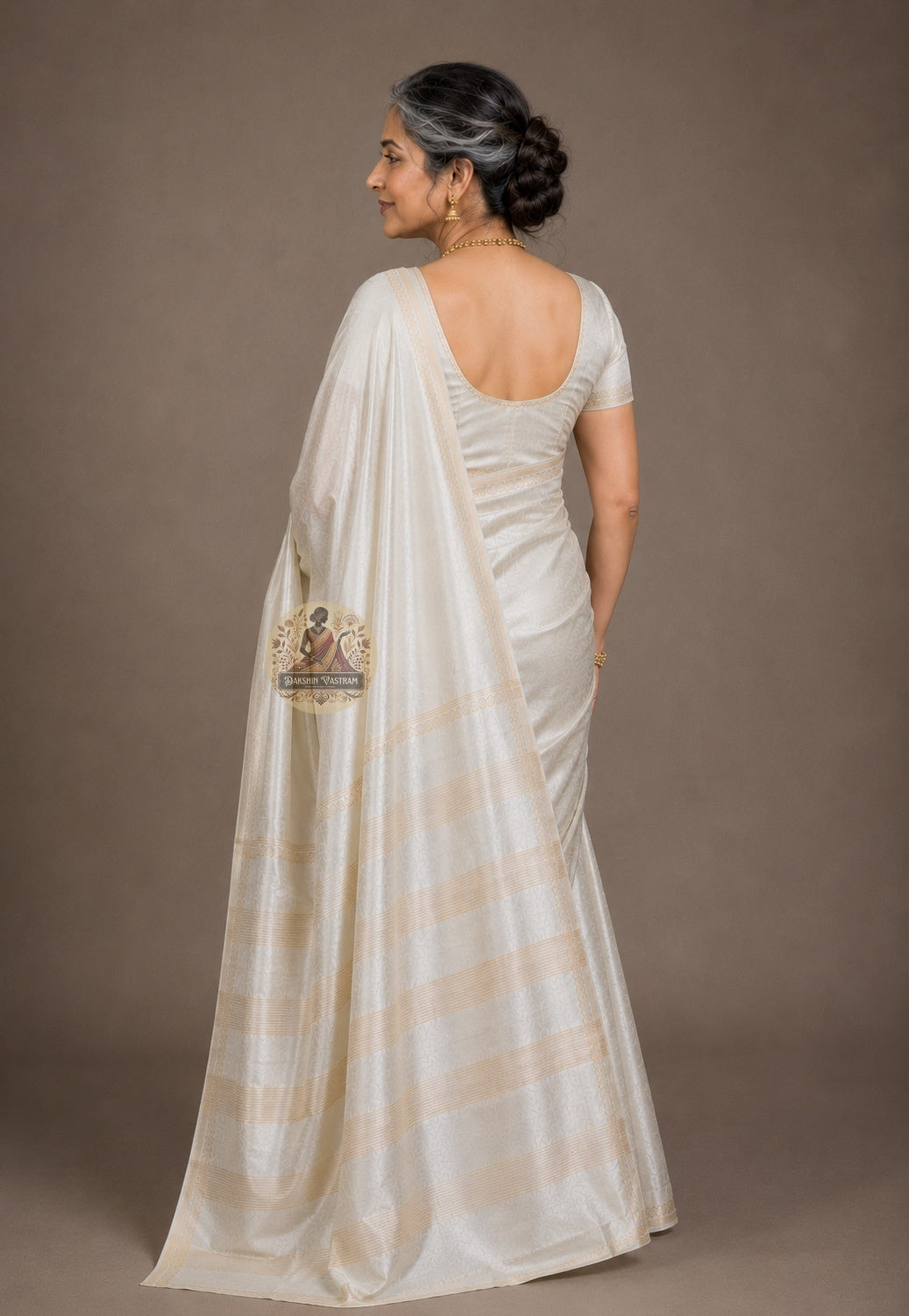 Rear view of handwoven Bishnupur Katan Silk Saree revealing the full pallu with hand-woven heritage motifs inspired by Bishnupur's terracotta temples, crafted to outlast the occasion it is made for