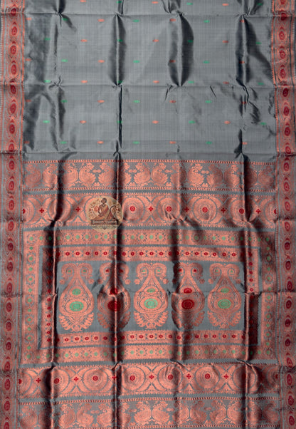 Side view of premium Swarnachari handloom silk saree showing wide golden zari language border and warm pure silk drape of a tradition that has always known how to speak, West Bengal weave