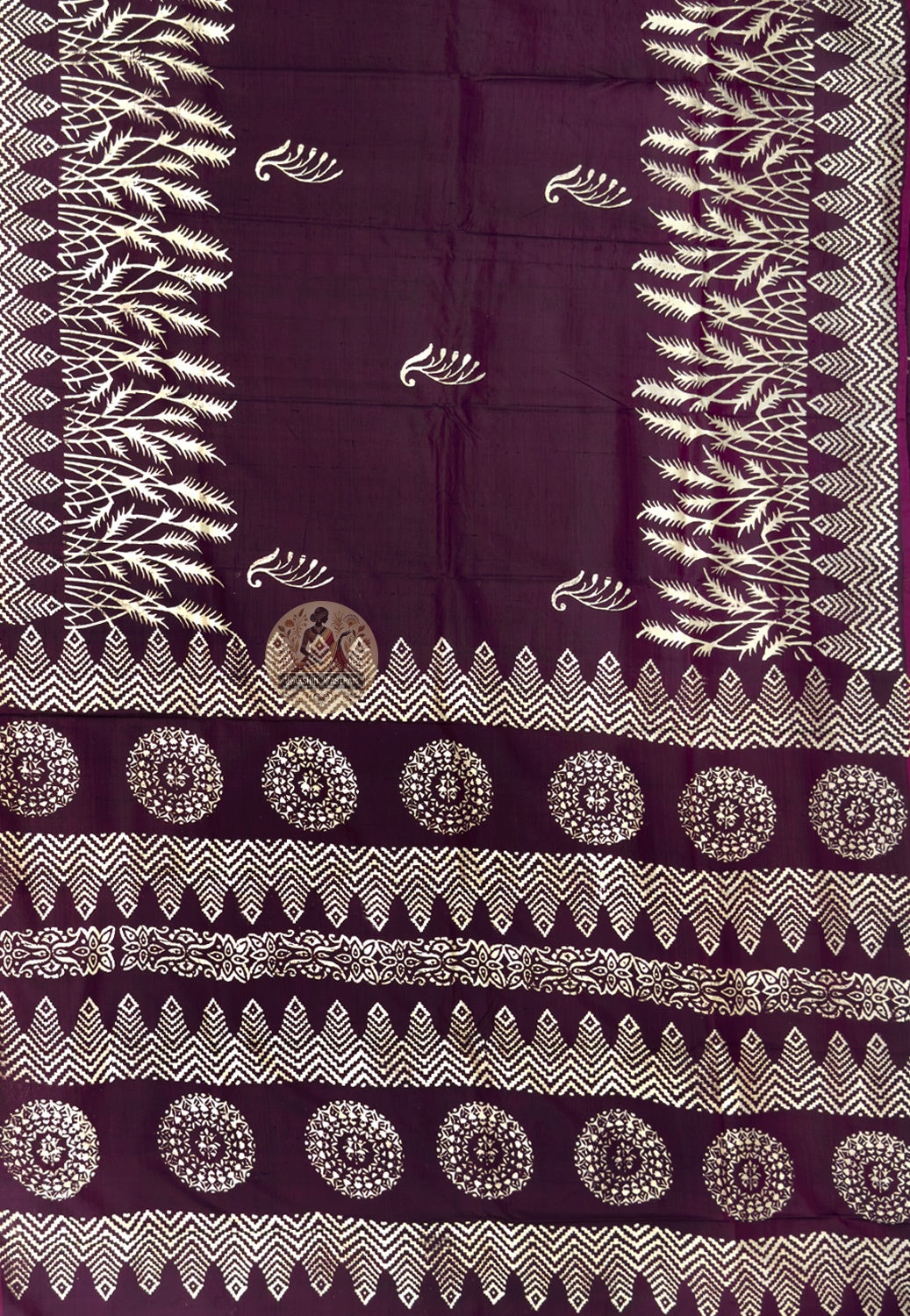 Close-up of hand-woven peacock and lotus motifs on the pallu of a Bishnupur Katan Silk Saree, reflecting centuries of Bengal weaving tradition