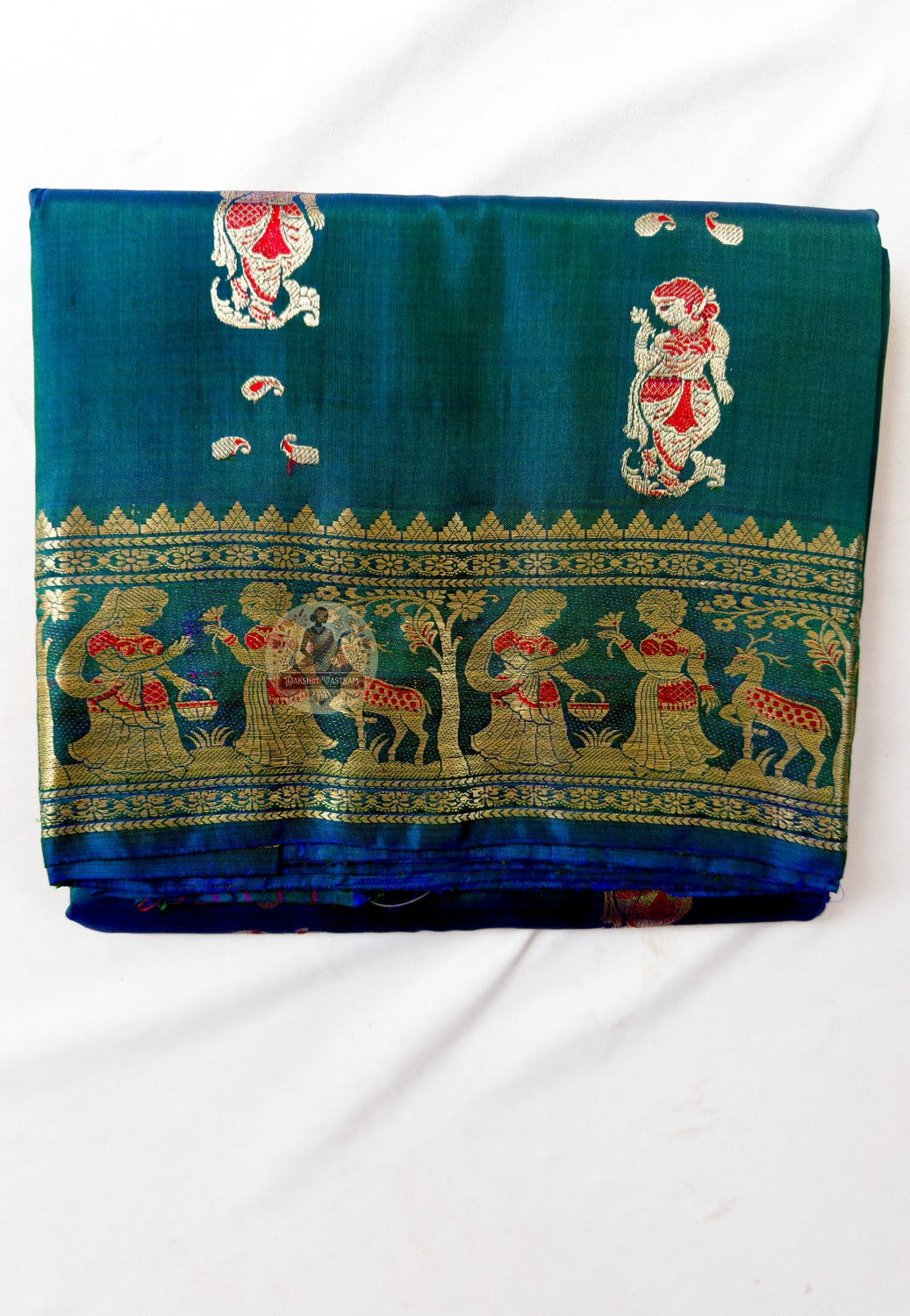 Close-up of pallu of Swarnachari pure silk saree showing golden zari royal court scene and temple art pattern woven thread by thread in West Bengal handloom