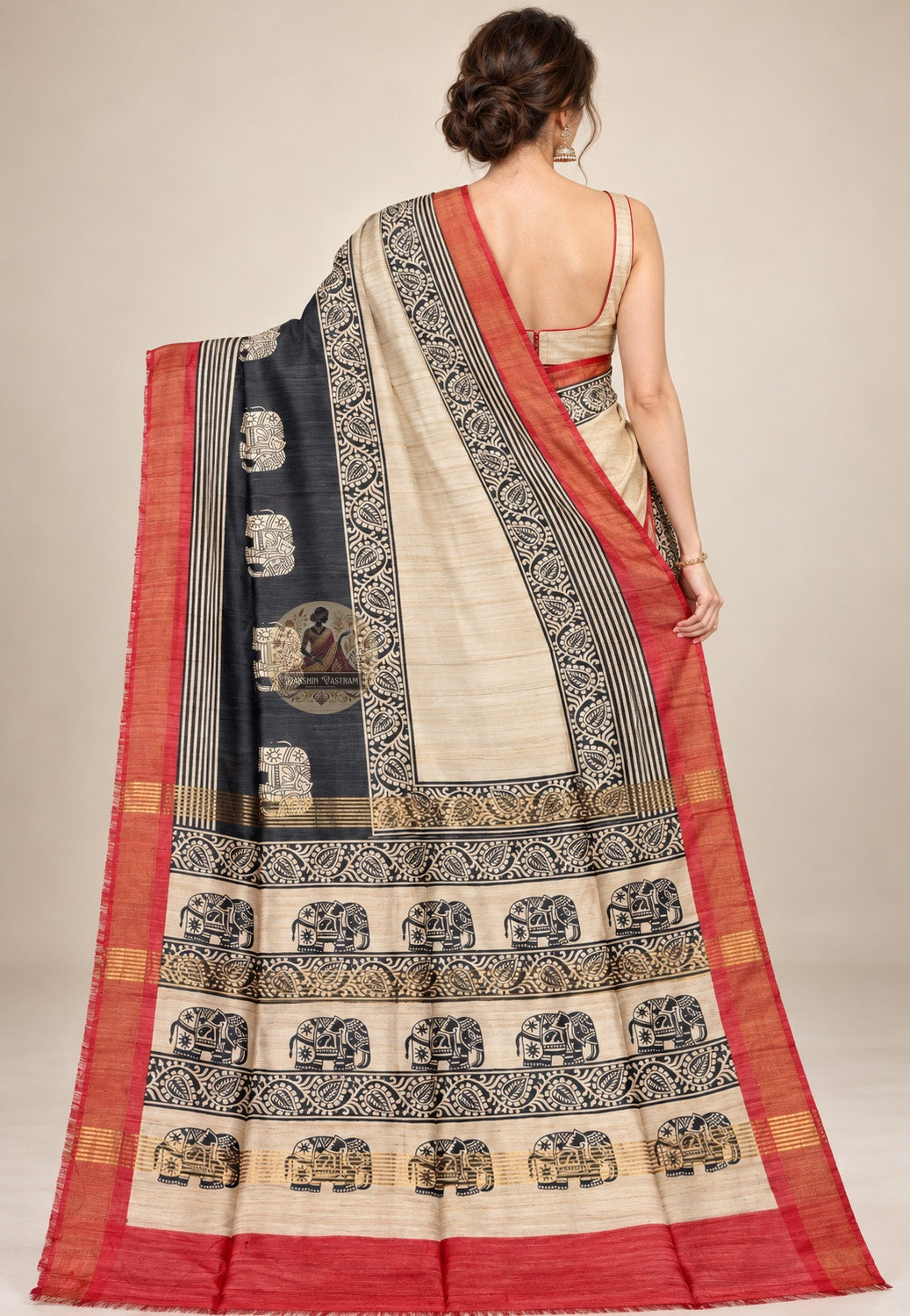 Side view of cream Ghicha Tussar silk saree showing the drape and contrasting black and red border