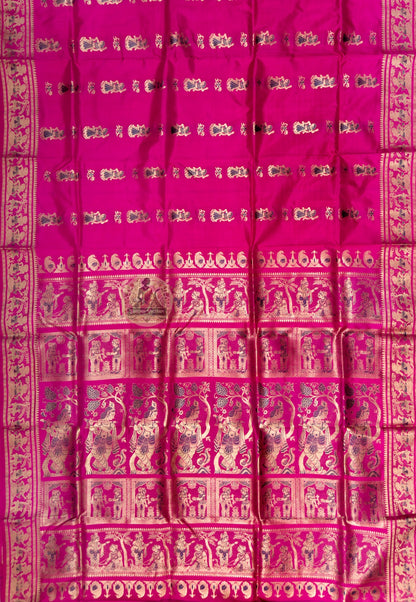 Full saree view of rani pink Swarnachari silk saree with small body motifs and an elaborate pallu