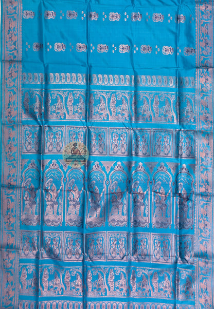 Full saree view of teal blue Swarnachari silk saree with repeating motifs and an elaborate pallu