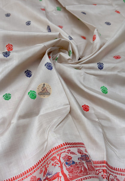 Full saree view of cream Baluchari silk saree with scattered motifs, red borders and a figurative pallu