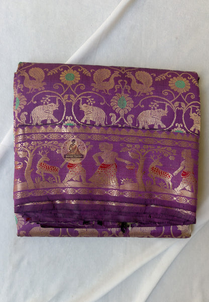 Rear view of premium Swarnachari silk saree displaying golden zari pallu with hand-woven unified narrative composition of Bengal temple and Ramayana-inspired scenes
