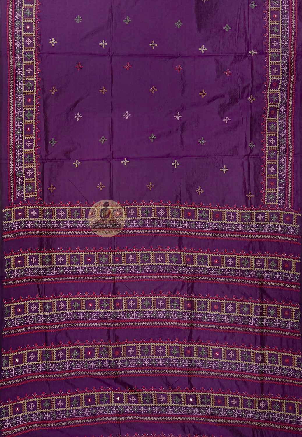 Close-up of hand-worked kantha stitch lotus bloom and peacock in full display on ivory Bishnupur silk saree Bankura West Bengal craft