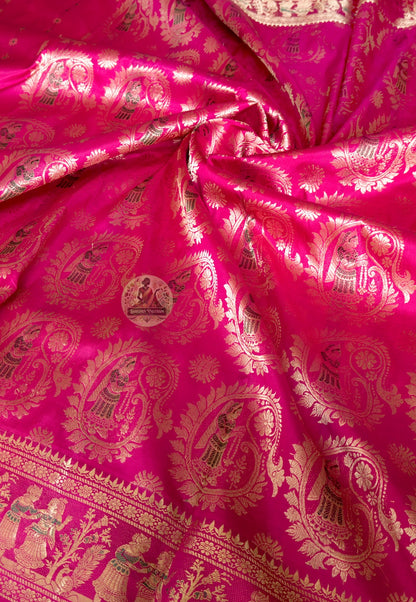 Close-up of pink Swarnachari silk saree weave showing golden zari mythology figures Malla court motifs and Bishnupur temple art patterns warming and deepening against pink silk ground