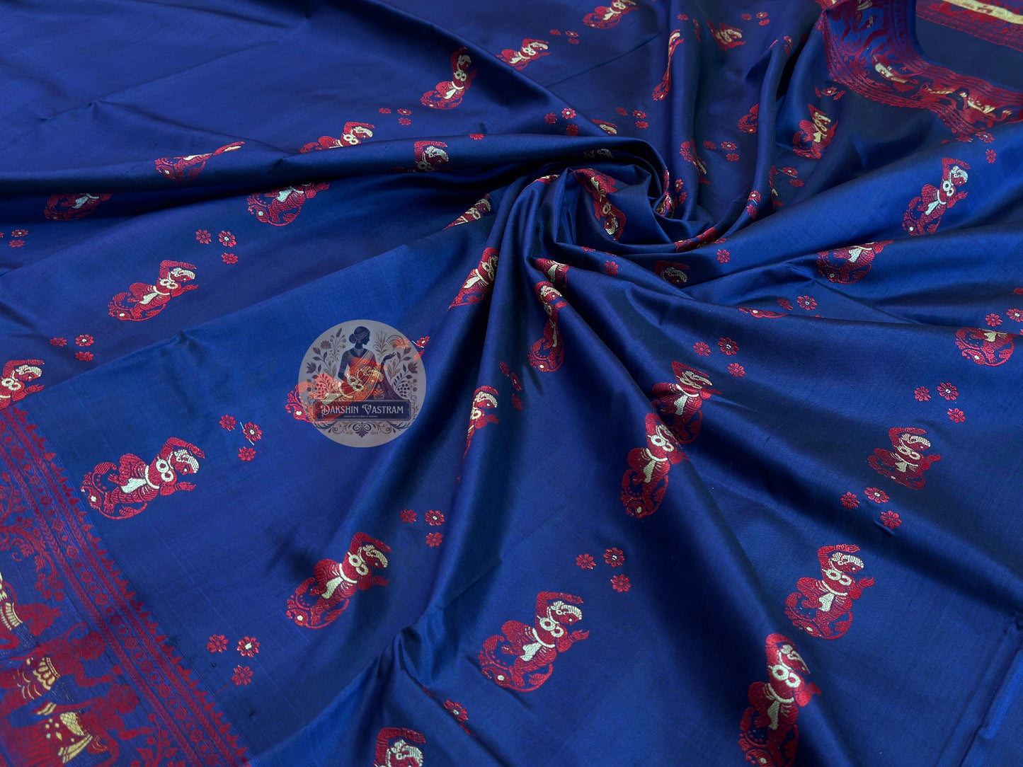 Detailed close-up of hand-woven border on Baluchari Silk Saree showing three-hundred-year-old geometric Bishnupur weave patterns in fine pure silk, a quiet declaration of enduring tradition