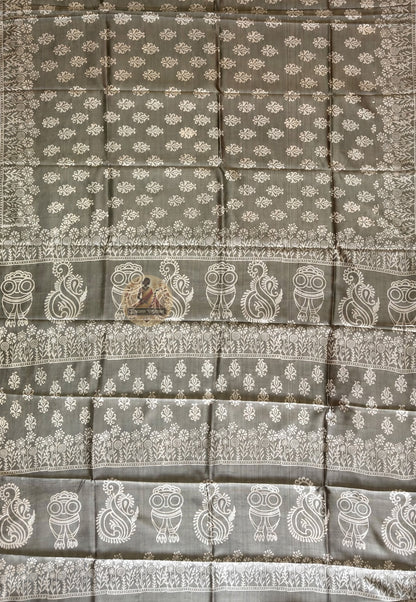 Close-up of Bishnupur Katan silk saree pallu showing hand block print composition with terracotta-inspired floral and figurative motifs pressed into pure silk using carved wooden blocks, Bishnupur West Bengal