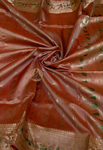 Close-up of Swarnachari silk saree pallu showing hand-woven golden zari panel expressing Bengal's visual identity through mythological figures and royal court heritage compositions