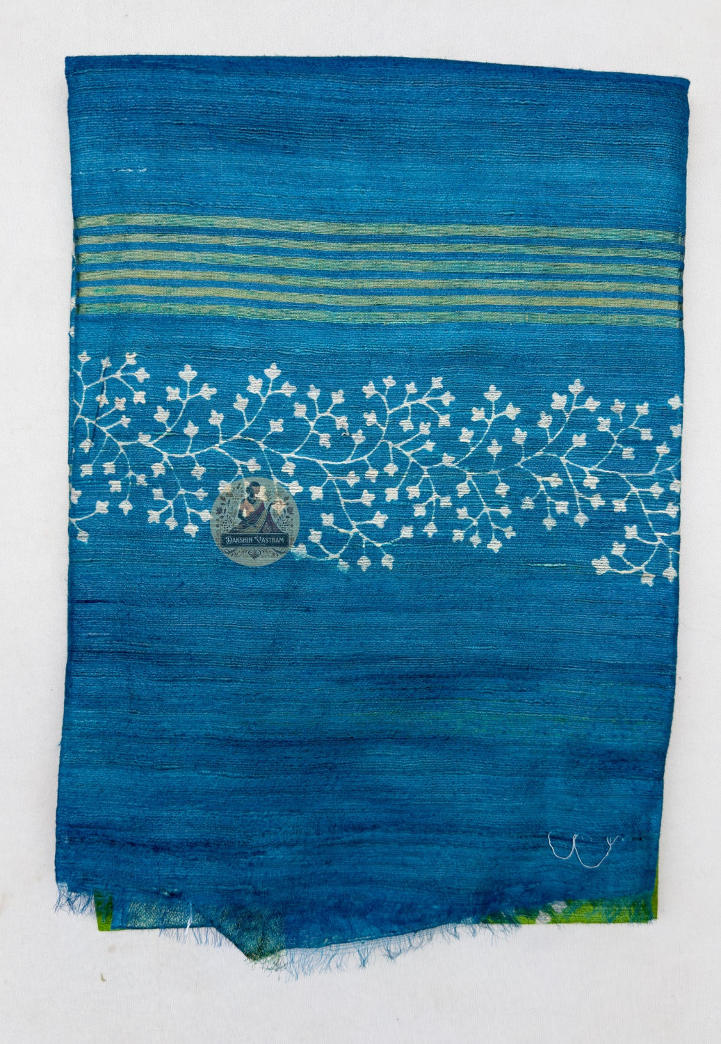 Close up of the blue pallu featuring pale floral bands and fine horizontal stripes