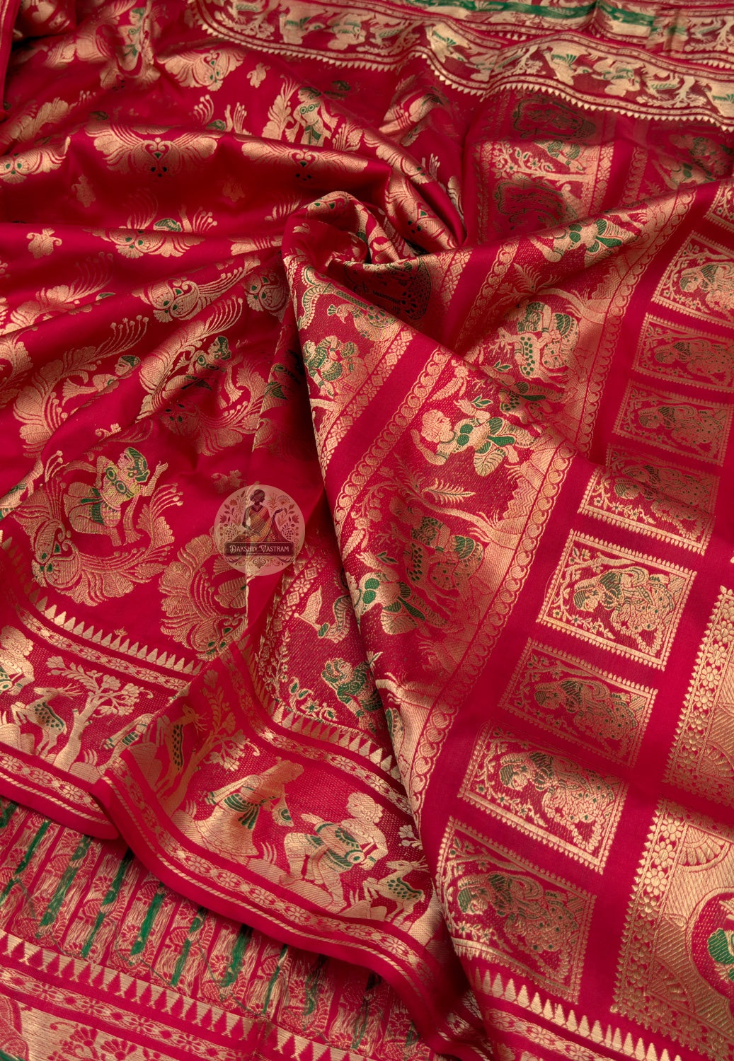 Close-up of Swarnachari handloom silk saree border with intricate golden zari threadwork, Bengal weaving tradition