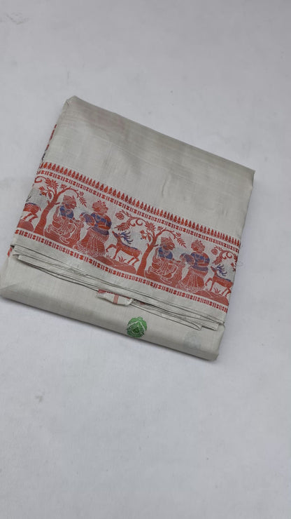 Full saree view highlighting the cream silk drape, red patterned border and multicoloured pallu